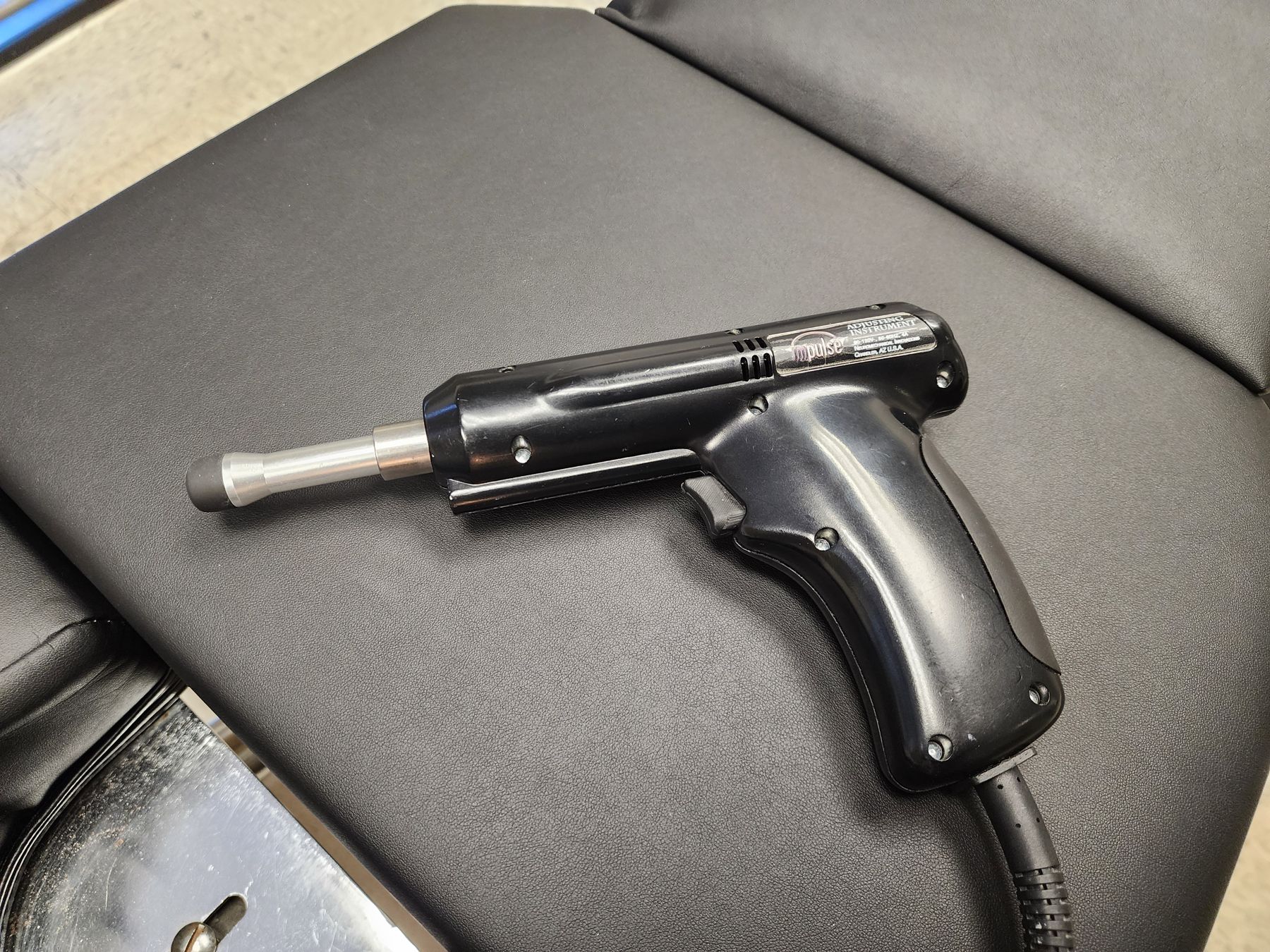 Impulse instrument used for low-force pediatric adjusting at Bonesetters in Chesterfield, MO