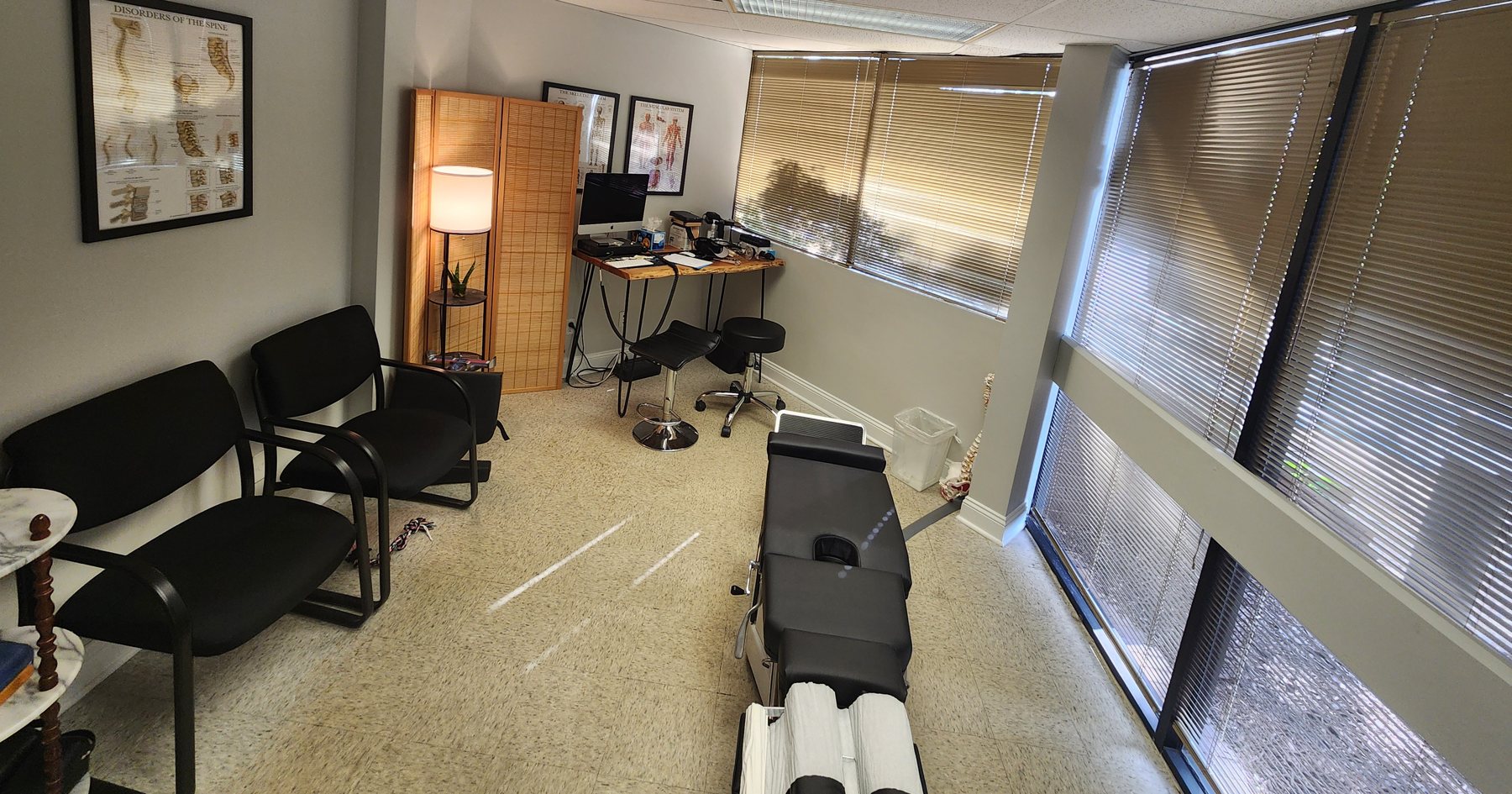 Treatment room with a chiropractic adjusting table at Bonesetters in Chesterfield, MO