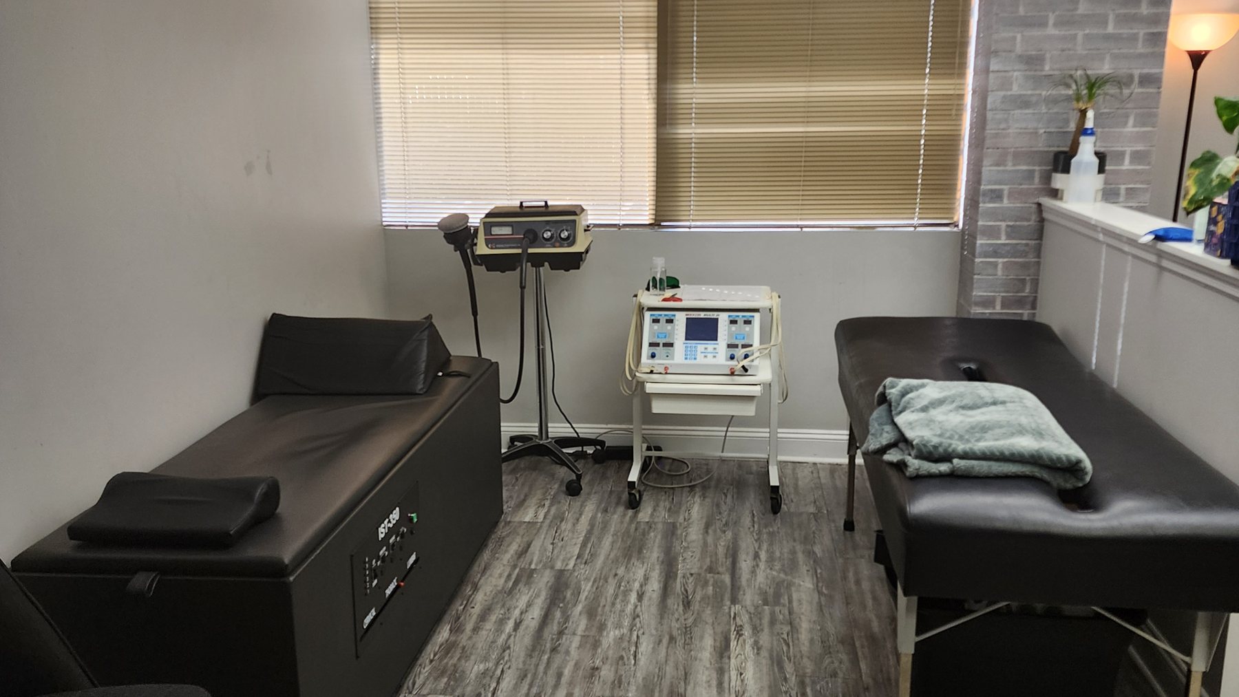 Therapy room at Bonesetters in Chesterfield, MO, with the IST-350 intersegmental traction table and additional modality units